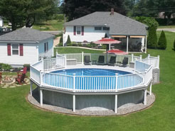 Round above ground pool with large deck shown.